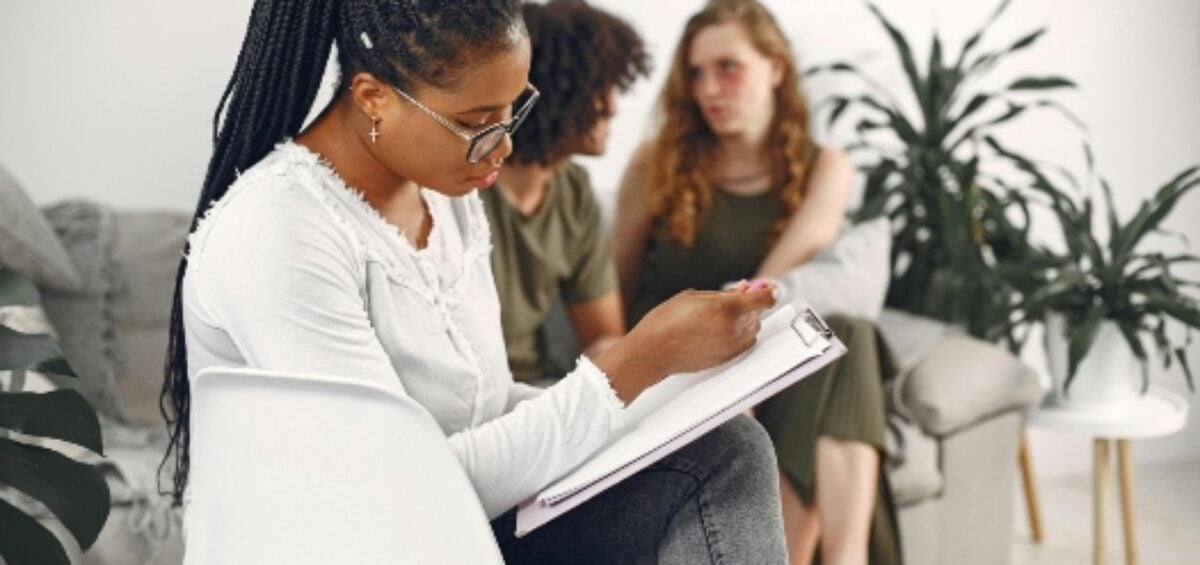 three people during a therapy session